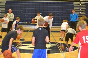 Coach Stapler leading ball-handling work.